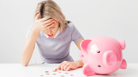 woman-counting-money-from-piggy-bank-legal-costs-family-law-miller-boileau-family-law